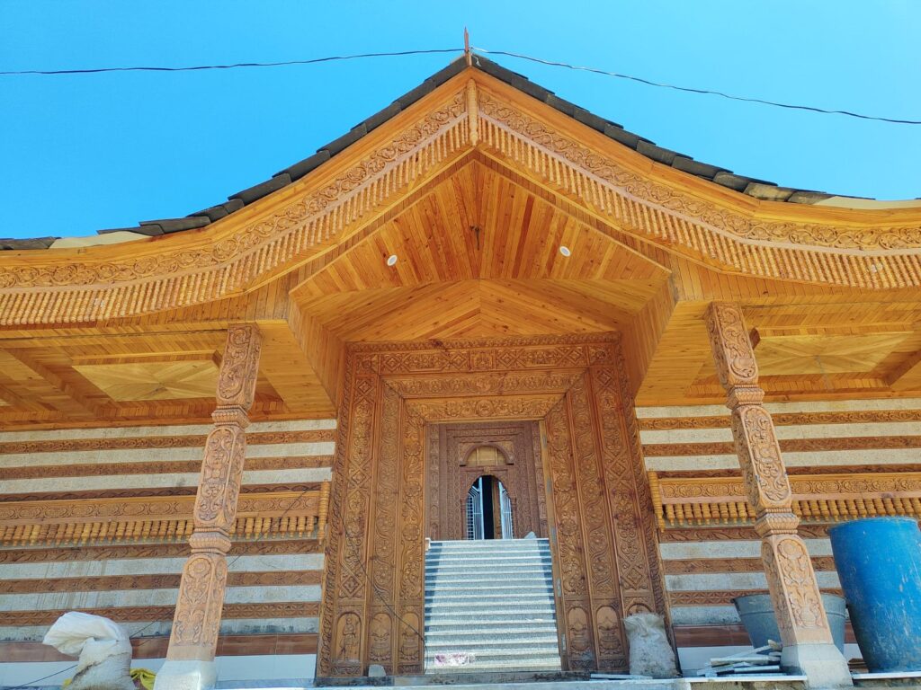 Beautiful wooden carving work at Dev Adi Bhram Temple entrance in Tihri Kullu Himachal Pradesh
