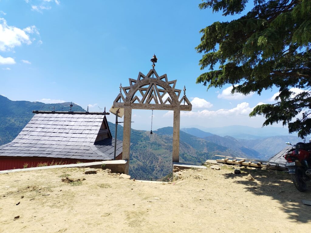 Traditional temple gate and mountain valley view at Dev Adi Bhram Temple Tihri